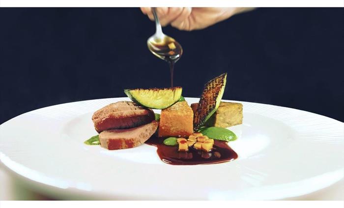 Local lamb served rare, khol rabi, potato darphin, courgette pesto, lamb jus